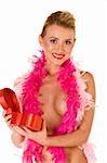 Friendly sexy blond with breasts covered by feather boa opening heart shaped gift box