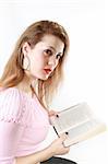 A young Caucasian girl reading a book. Against the white. (See also my other pics)