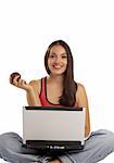 view of nice young girl sitting with laptop and apple   on white