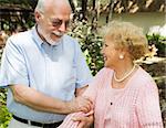 Loving senior couple enjoying a stroll outdoors.