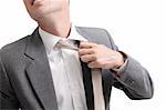 young stressed businessman unfastening his tie