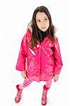 Young girl posing in a pink raincoat