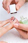 applying manicure: moisturizing the nails and skin around nails