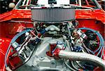 Highly customized car engine in a rebuilt muscle car - all copyright materials removed