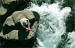 Old man fishing in a salmon river