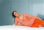 Beautiful woman in pajama on bed and relaxing