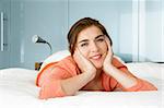 Portrait of a beautiful woman in bed smiling
