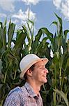 farmer in front of a corn field