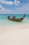 Longtail boat in bright blue water, Koh Poda, Krabi Province, Thailand