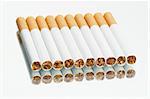 Cigarettes in a row on a mirror - white background