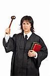 Angry female judge holding the gavel and books. Shallow depth of field