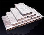 stack of pure silver bars on a reflective surface.