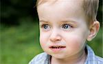 Young Boy Portrait On The Nature Background