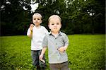 Outdoors Lunch. Two Brothers On The Meadow.