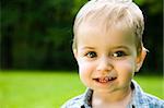 Little Smiling Baby Relaxing Outdoors