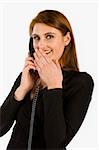 Women talking on phone with surprised look on her face against white background