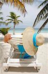 Nice vacation picture with woman sitting on a lounger