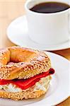 Light meal of smoked salmon bagel and coffee