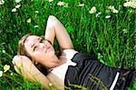 Young Beautiful Woman Laying On The Grass