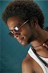 Portrait of young handsome african male wearing sunglasses