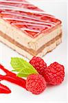 Delicious raspberries cake with soft shadow on white dish. Shallow depth of field