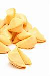 fortune cookies pile closeup isolated on white