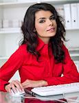 Beautiful business woman is working in office