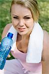 blond woman drink water after fitness workout