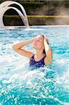 young blond woman relaxing in beauty spa