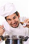 young chef preparing lunch with poison bottle