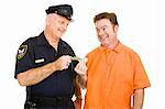Police officer accepts cash bribe from a prison inmate.  Isolated on white.