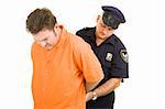 Prisoner in orange jump suit being handcuffed by police officer.  Isolated on white.