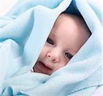 Adorable newborn swathed in cloth