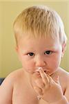 toddler boy with his face dirty in ice-cream