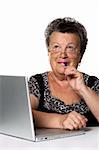 The old woman with modern laptop on a white background