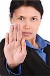 A young woman using her hand to stop something, directing to the camera. Focus mainly on the palm. Shoot against very bright white background to naturally seperate the model and background.