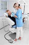 doctor works with patient in the dentist office