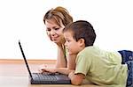 Child surfing the net under supervision - isolated, focus on the boy face