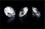 3d rendering three diamonds on a black reflective floor
