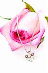 Heart pendant with diamond with a pink rose