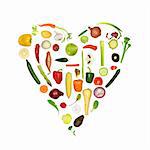 Heart of fresh vegetables, symbolizing a healthy heart, over white background.