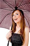 side pose of smiling woman holding umbrella with white background