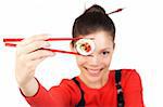 Beautiful woman holding a tuna maki sushi. Sushi is in focus, model is out of focus. Isolated on white.