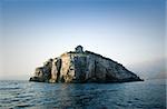 Villa on an island in the Mediterranean nearby Budva, Montenegro. Foggy background