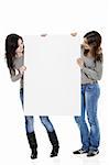 Portrait of two beautiful young women holding a blank notecard.