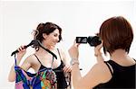 two women showing new clothes and having fun with camcorder