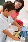 Mother And Son Doing Laundry