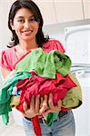 Woman Holding Pile Of Laundry