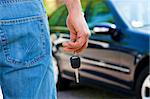 close up of man holding keys to new car. Copy space