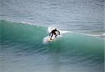 Young men - the surfer in ocean. Bali. Indonesia